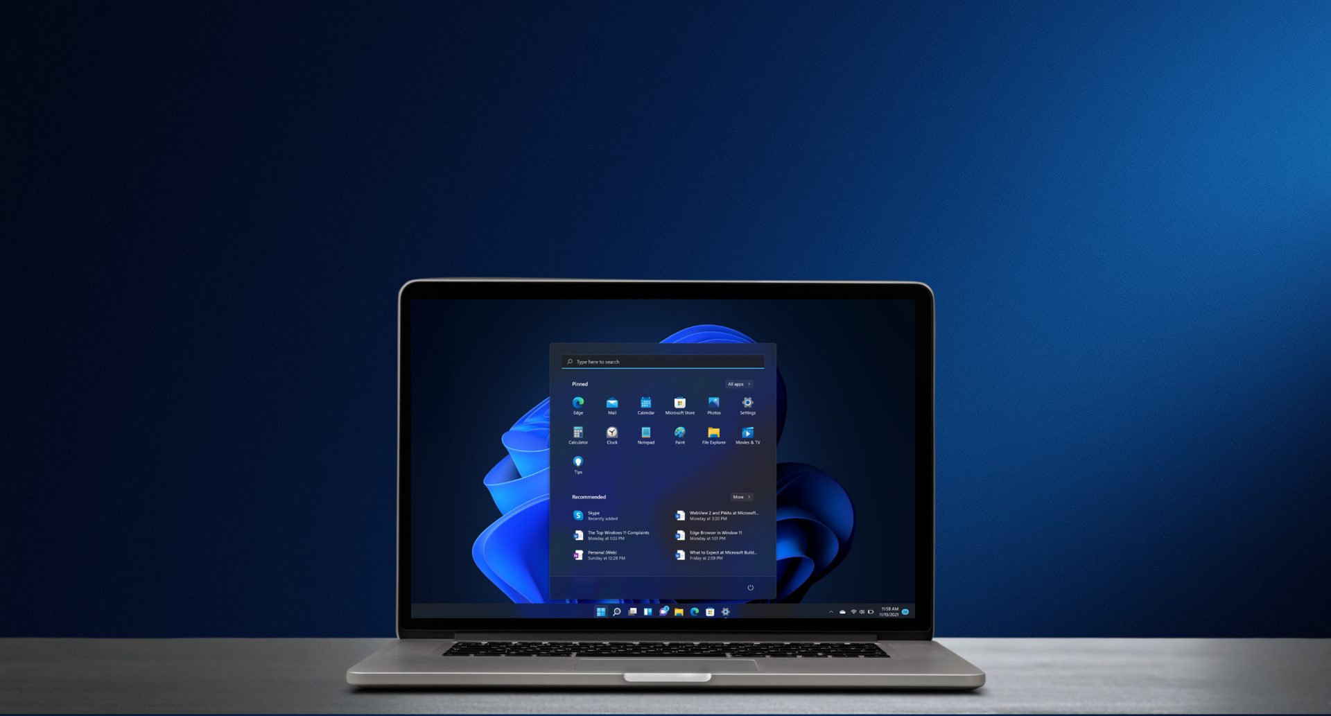 A laptop displaying the Windows 11 Start menu on its screen.